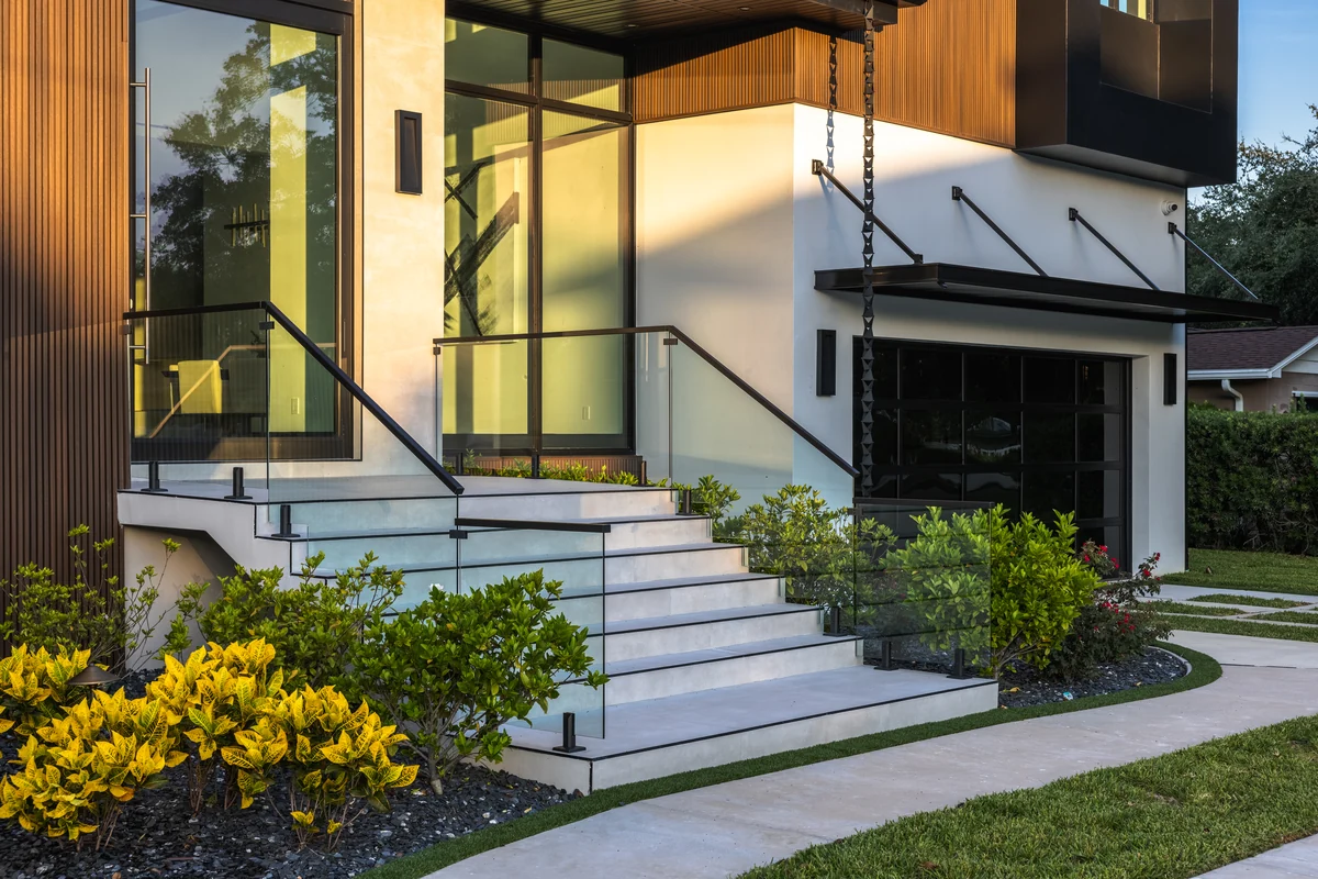Entry steps, glass doors, and landscaping at Skyward